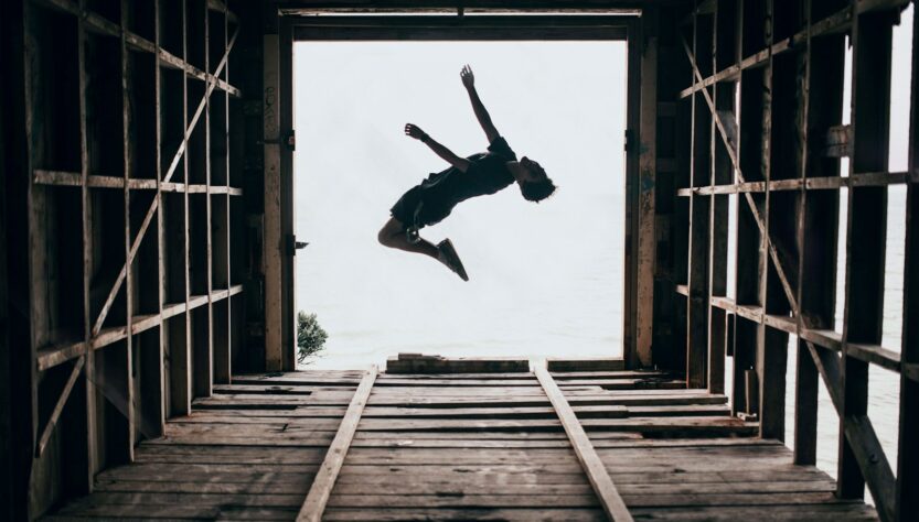 boy jumping on focus photography